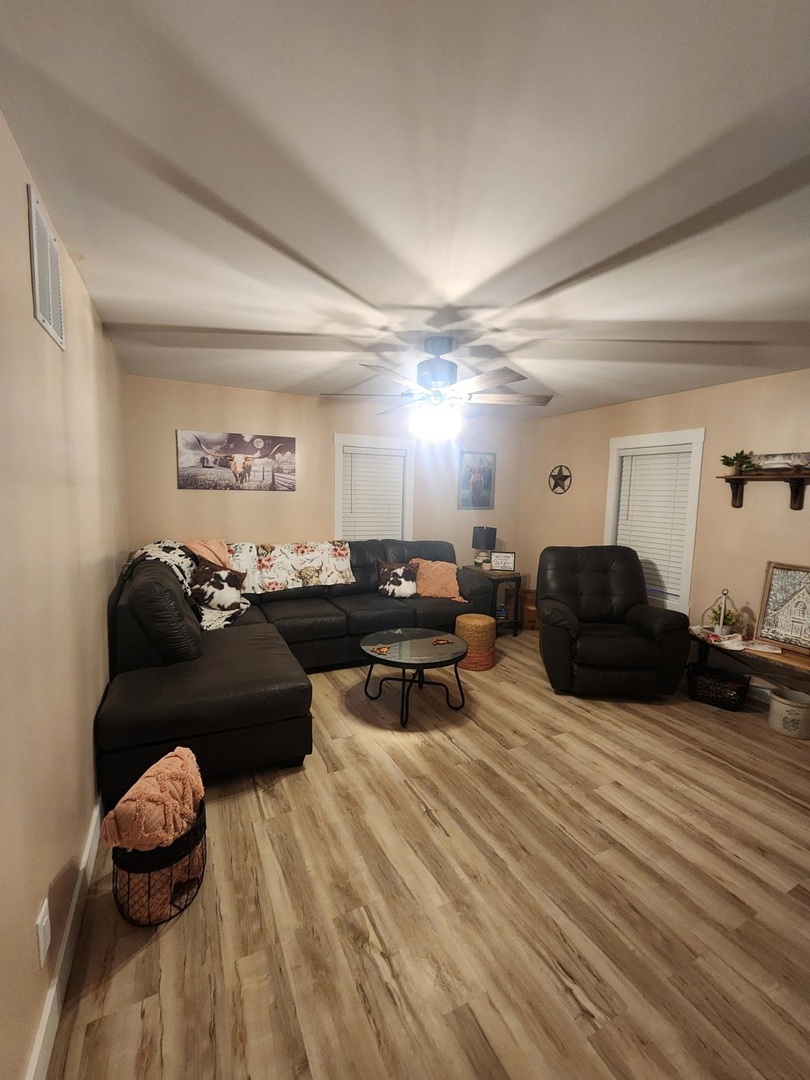 8350 Highway 147 Simpson, IL 62985 - Photo 3 of 23 a living room with furniture a wooden floor and a fireplace