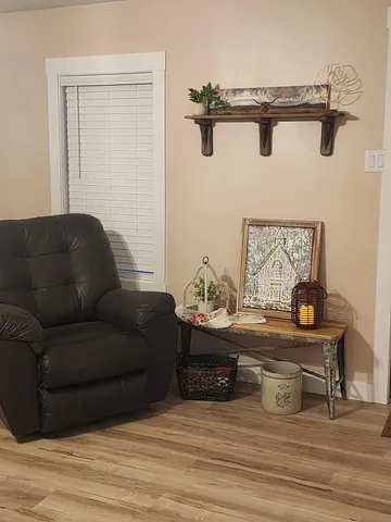 a living room with furniture and a table