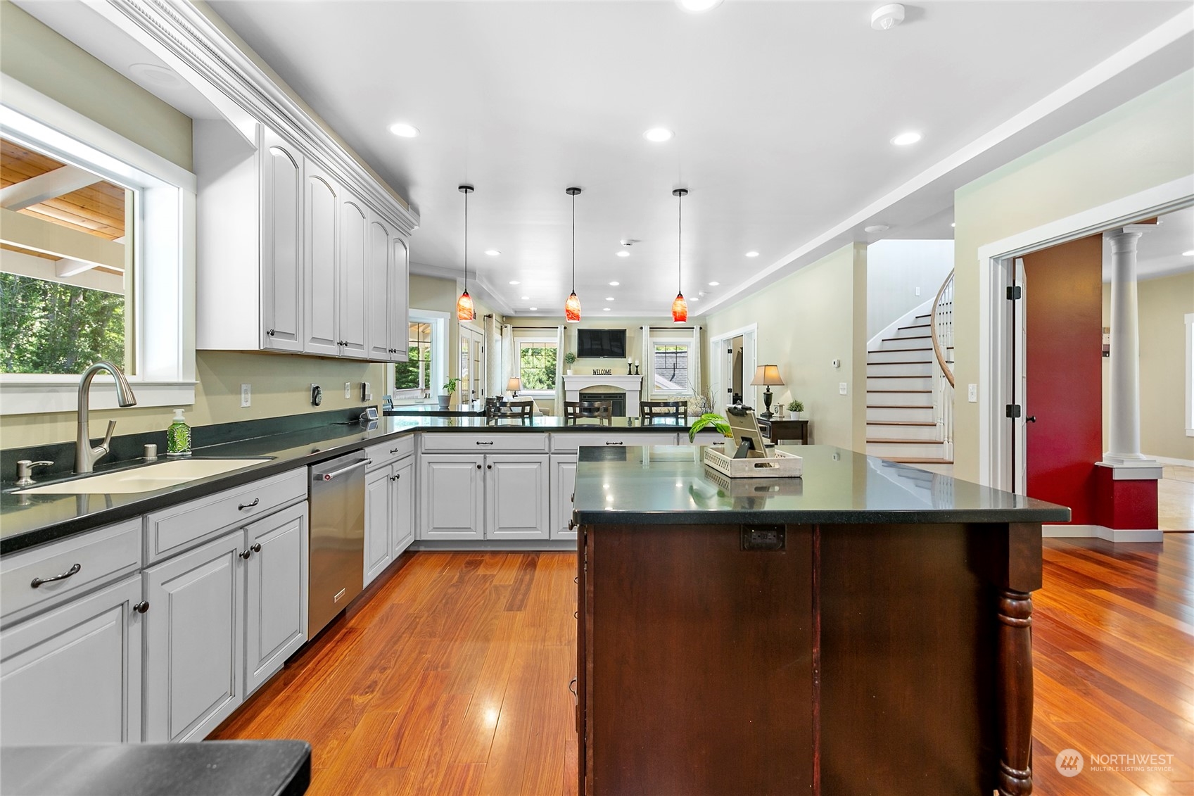 3460 Aldergrove Road Ferndale, WA 98248 - Photo 11 of 39 a kitchen with stainless steel appliances granite countertop a sink a stove and cabinets