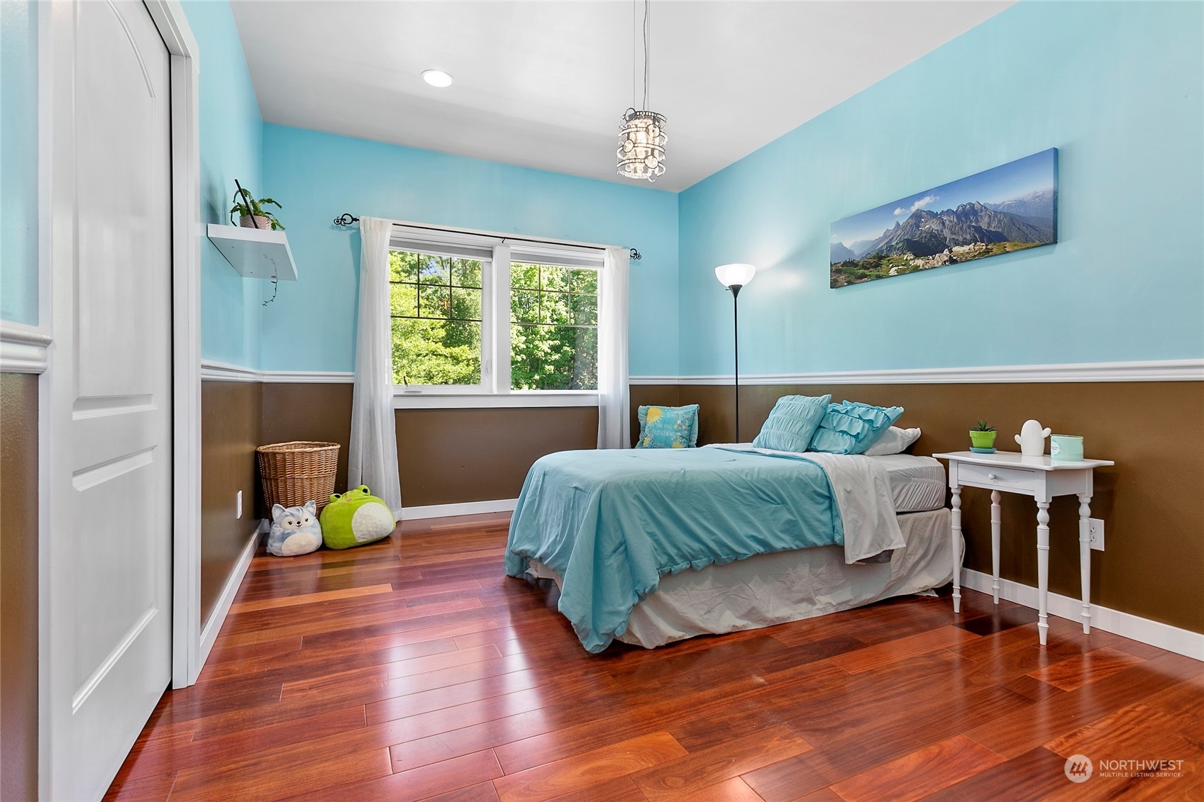 3460 Aldergrove Road Ferndale, WA 98248 - Photo 24 of 39 a bedroom with a bed and wooden floor