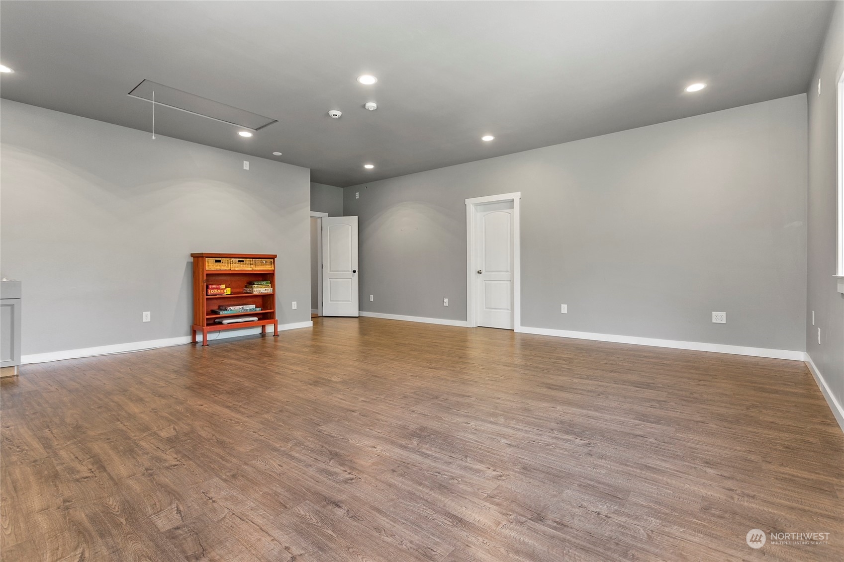 3460 Aldergrove Road Ferndale, WA 98248 - Photo 27 of 39 an empty room with wooden floor and bench