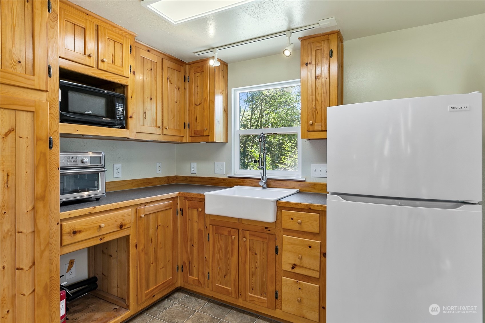 3460 Aldergrove Road Ferndale, WA 98248 - Photo 38 of 39 a kitchen with stainless steel appliances white cabinets and a refrigerator