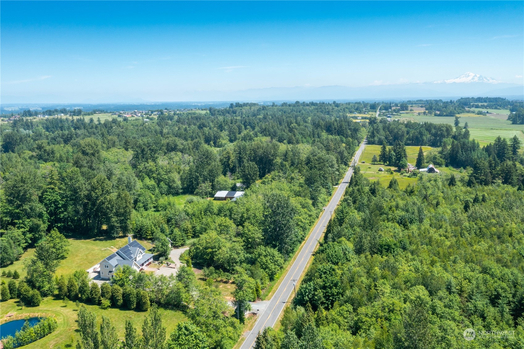 3460 Aldergrove Road Ferndale, WA 98248 - Photo 39 of 39 a view of a city with lush green forest