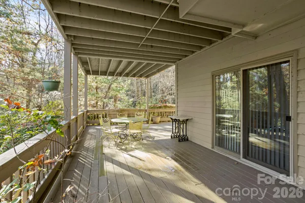 a view of a balcony with wooden floor