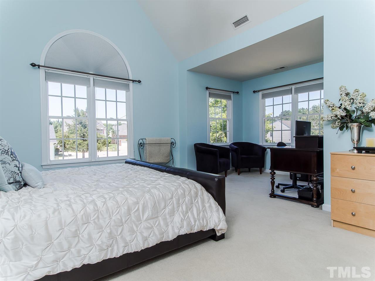 5108 Amberfield Way Raleigh, NC 27604 - Photo 14 of 23 a large bedroom with bed tv and window