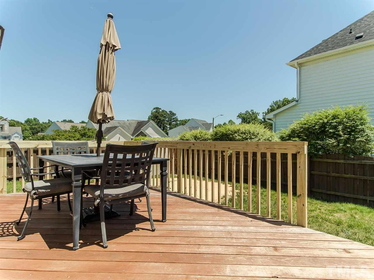 5108 Amberfield Way Raleigh, NC 27604 - Photo 22 of 23 a view of a dinning table and chairs in patio