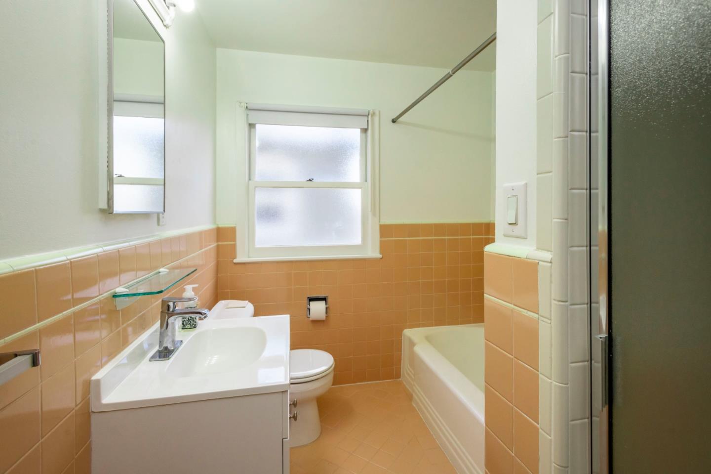 1556 Albemarle Way Burlingame, CA 94010 - Photo 14 of 18 a bathroom with a sink a toilet and shower