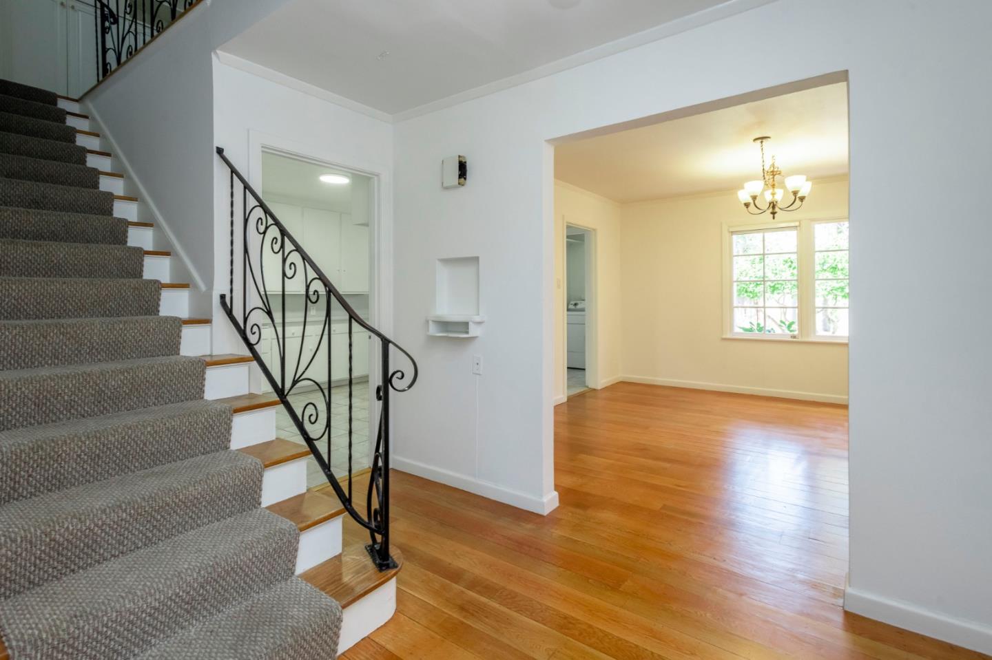 1556 Albemarle Way Burlingame, CA 94010 - Photo 3 of 18 a view of an entryway with wooden floor and a livingroom view
