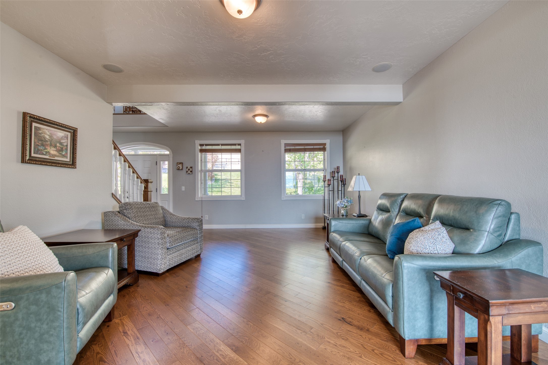 16374 Folsom Road Florence, MT 59833 - Photo 54 of 98 Living area with wood-type flooring, a textured ceiling, and stairs