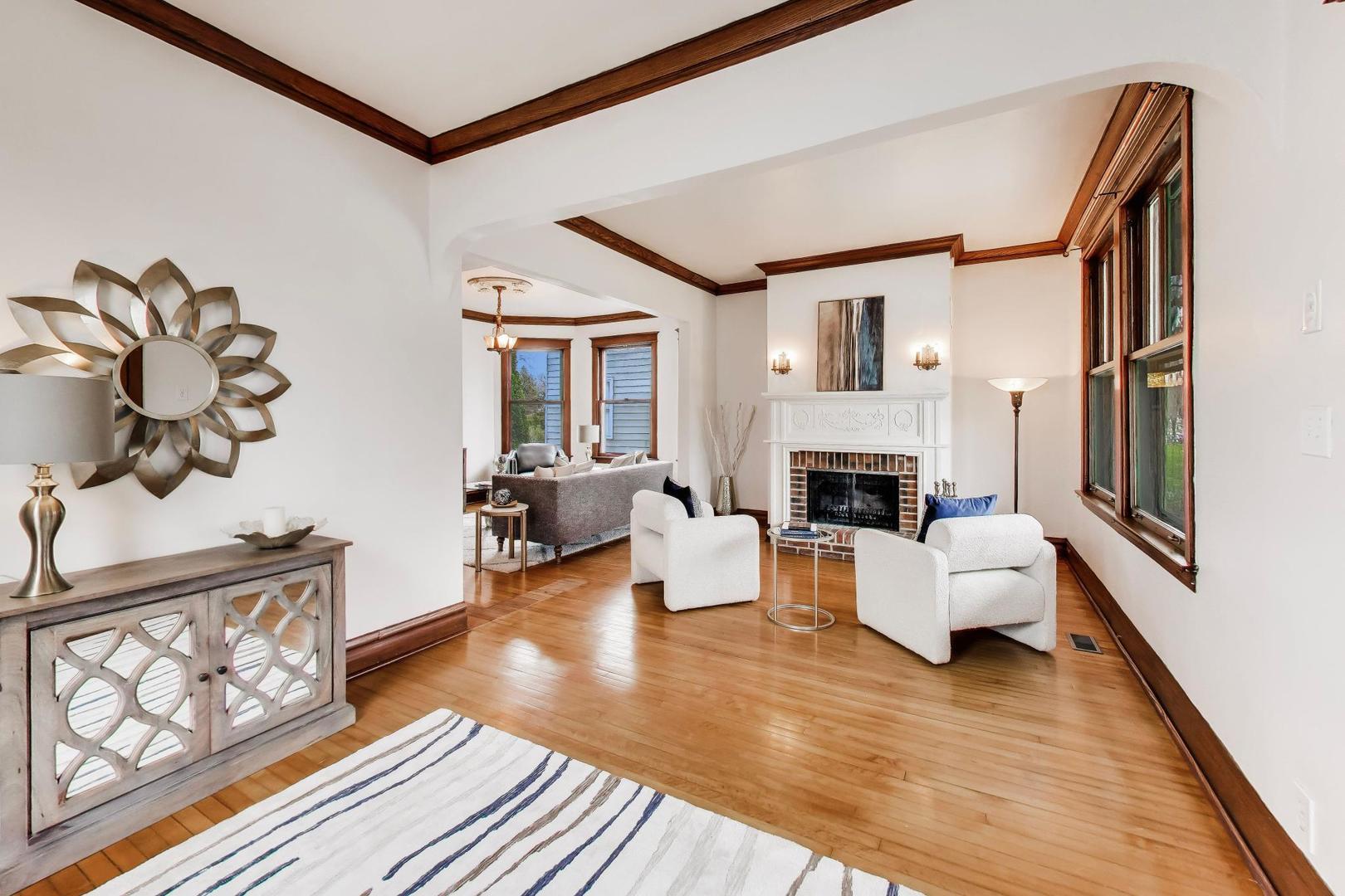256 Blackhawk Road Riverside, IL 60546 - Photo 6 of 73 a living room with fireplace furniture and a wooden floor