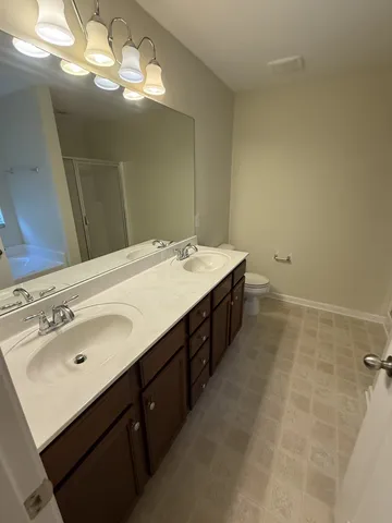 a bathroom with a bathtub and a window