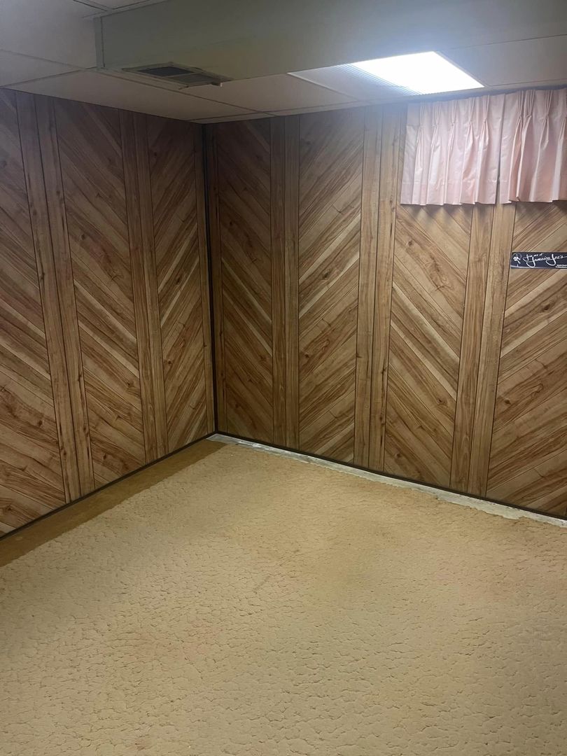 24 Brookwood Drive Normal, IL 61761 - Photo 11 of 12 a view of a room with wooden walls