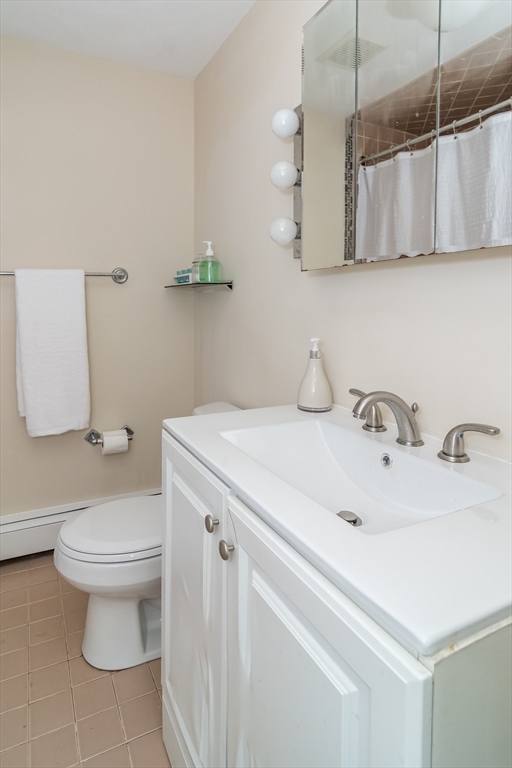 57 Wethersfield Road Natick, MA 01760 - Photo 17 of 28 a bathroom with a sink toilet and vanity