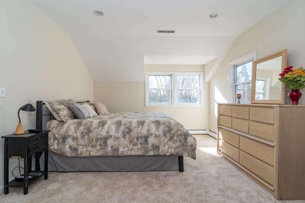 57 Wethersfield Road Natick, MA 01760 - Photo 23 of 28 a spacious bedroom with a bed and window