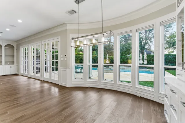 a kitchen with stainless steel appliances granite countertop a stove and a window