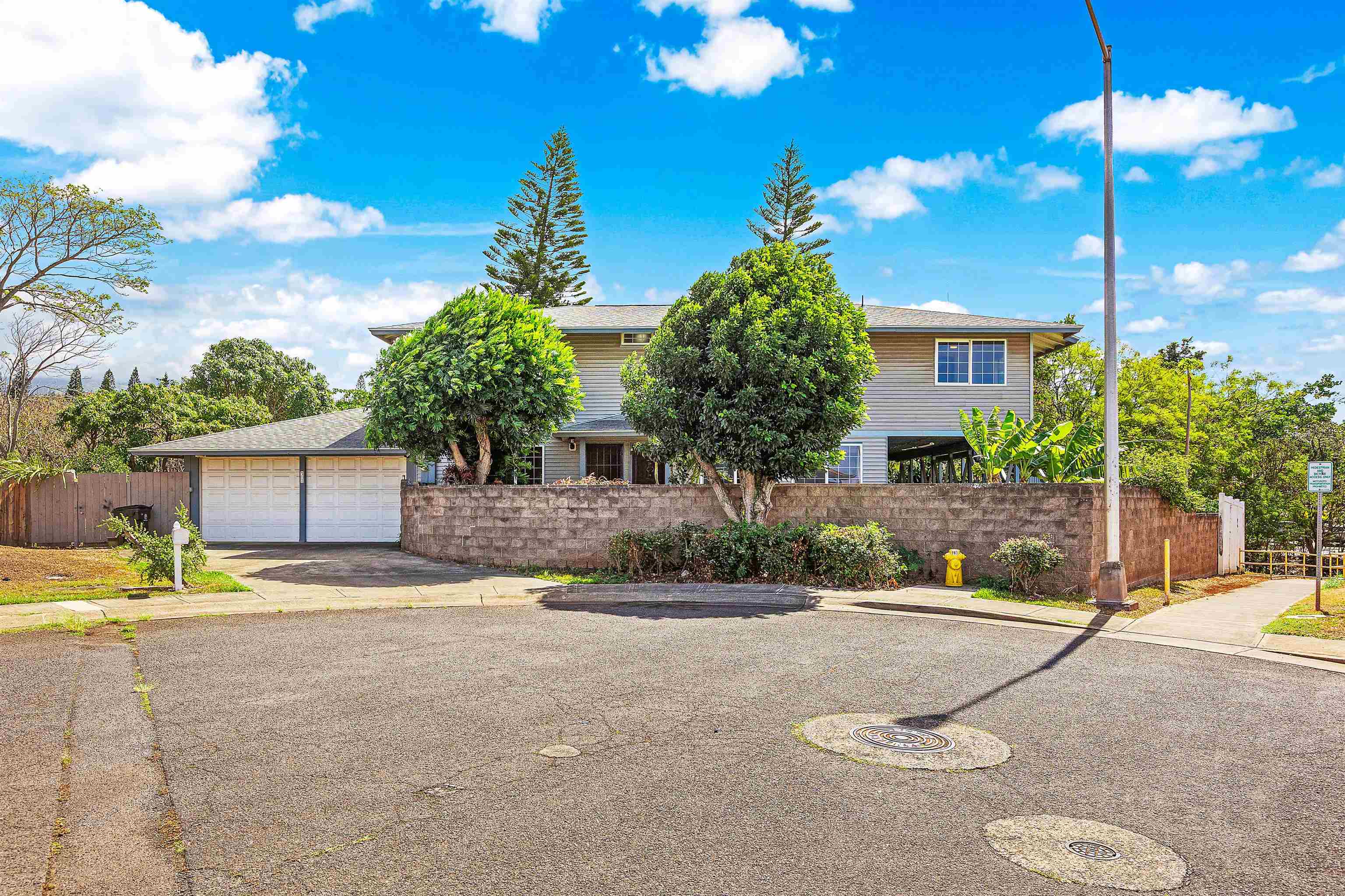 31 Pualu Loop Lahaina, HI 96761 - Photo 13 of 40 a view of a house with a patio and a garden