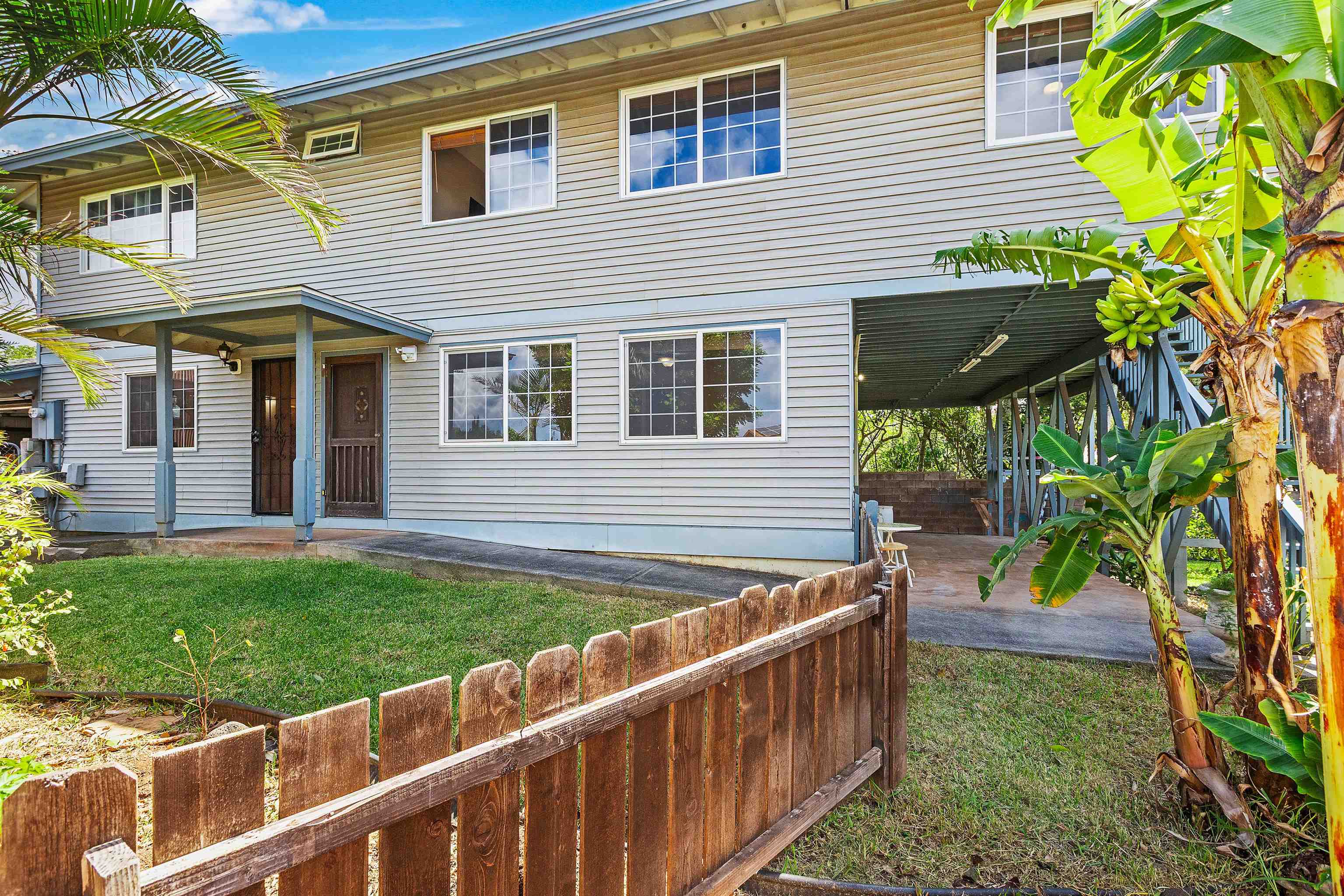 31 Pualu Loop Lahaina, HI 96761 - Photo 17 of 40 a view of a house with a yard and sitting area