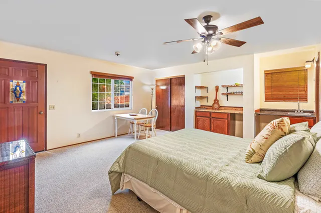 a bedroom with a bed furniture and a window