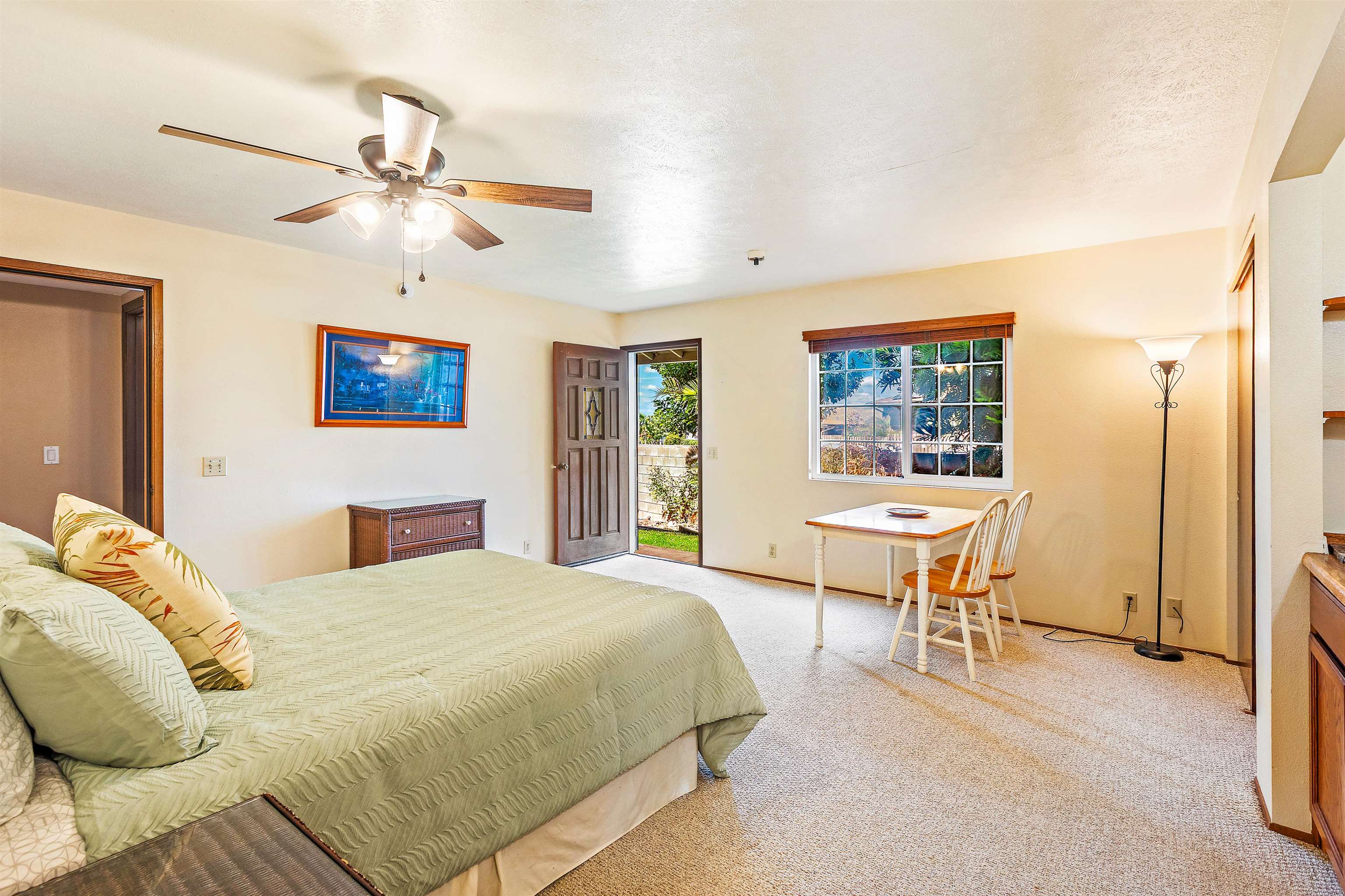 31 Pualu Loop Lahaina, HI 96761 - Photo 30 of 40 a bedroom with a bed and a chandelier