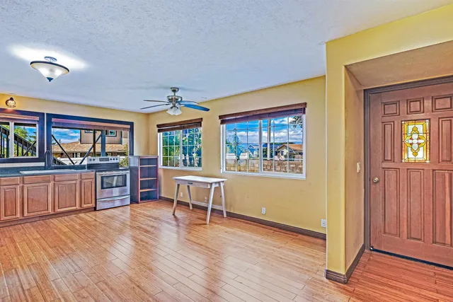 a view of a livingroom with furniture window and wooden floor