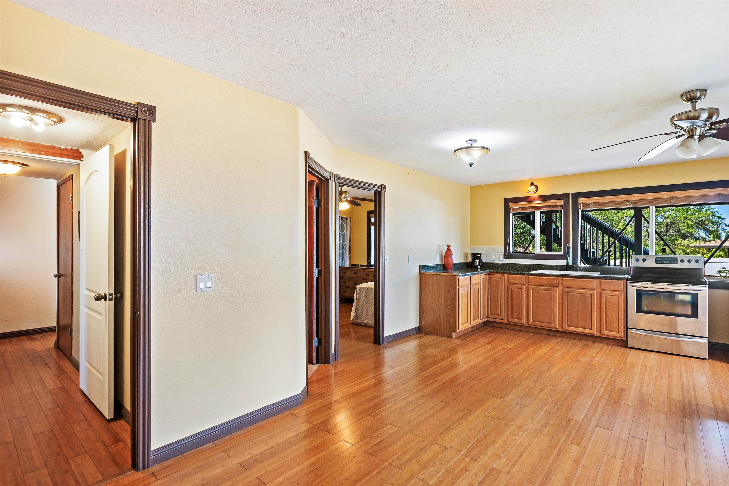 31 Pualu Loop Lahaina, HI 96761 - Photo 35 of 40 a view of a large kitchen with wooden floor and outdoor space