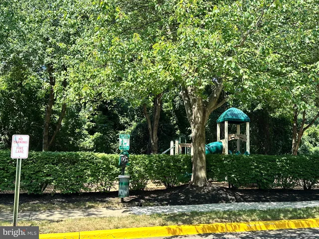 a view of a patio with a table and chairs