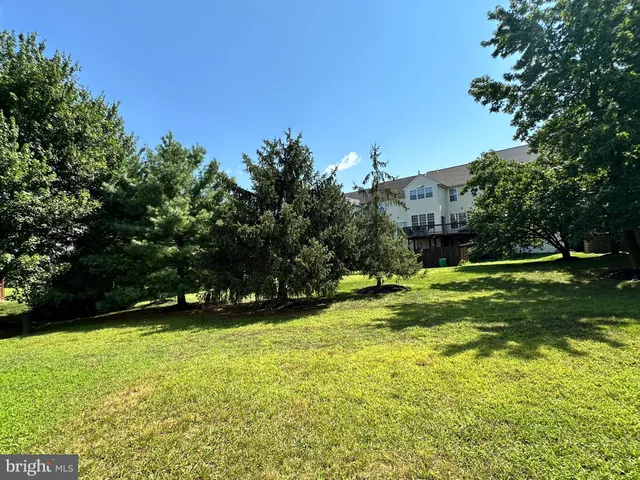 a view of a cars park in front of a building