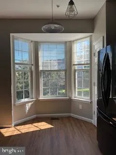 a view of room with window wooden floor