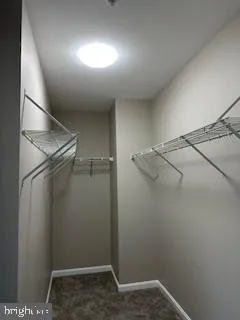 an empty room with an empty space and wooden floor