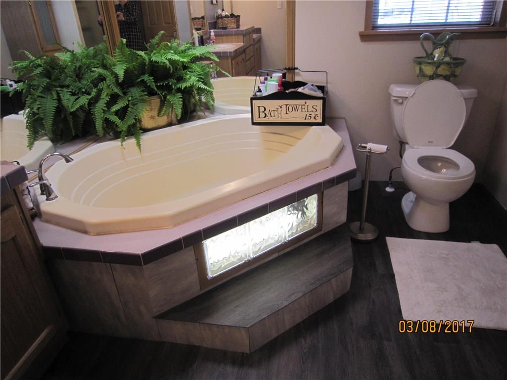 113 Braddock Road Smithfield, PA 15478 - Photo 16 of 24 MASTER BATH- SUNKEN TUB, LIGHTED STEP. ALSO A STAND ALONE SHOWER WITH DOOR!