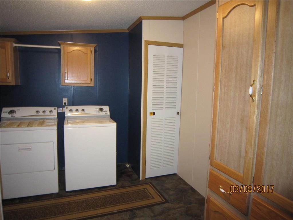 113 Braddock Road Smithfield, PA 15478 - Photo 9 of 24 LARGE LAUNDRY ROOM OFF KITCHEN-EASY TO CLEAN VINYL FLOOR