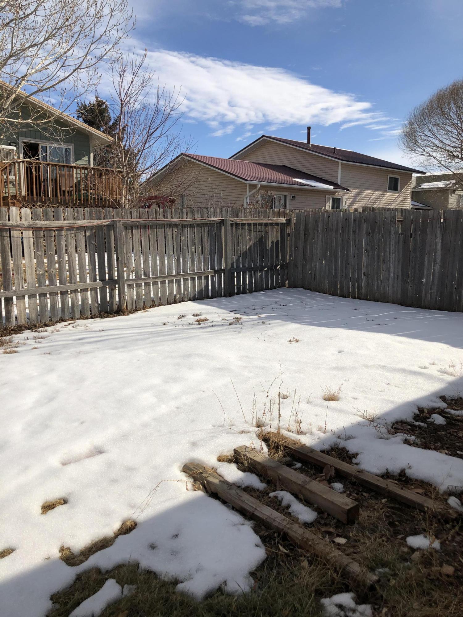 620 Elm Court Rifle, CO 81650 - Photo 15 of 16 a view of wooden fence next to a yard