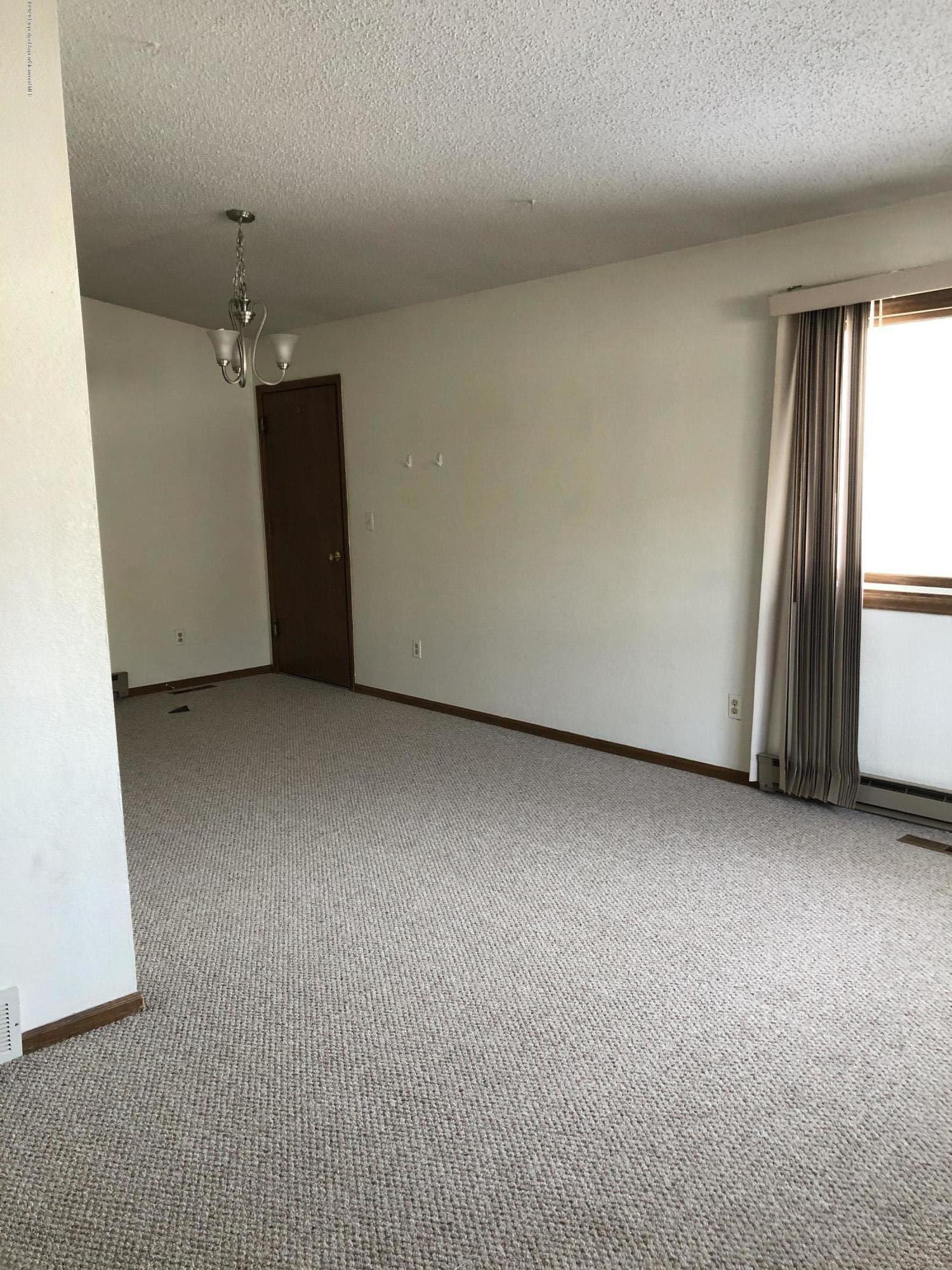 620 Elm Court Rifle, CO 81650 - Photo 2 of 16 a view of an empty room with a window
