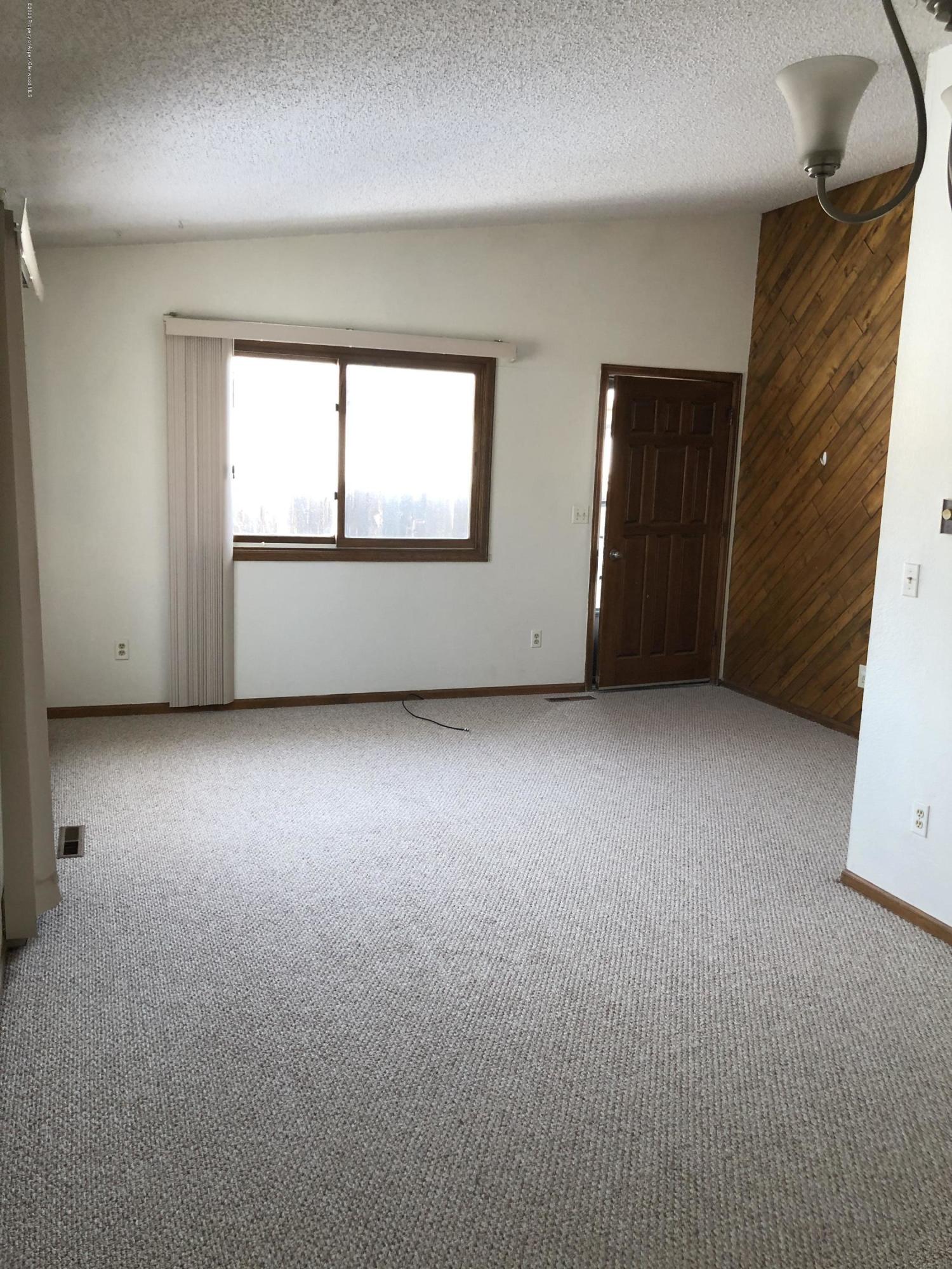 620 Elm Court Rifle, CO 81650 - Photo 3 of 16 an empty room with windows