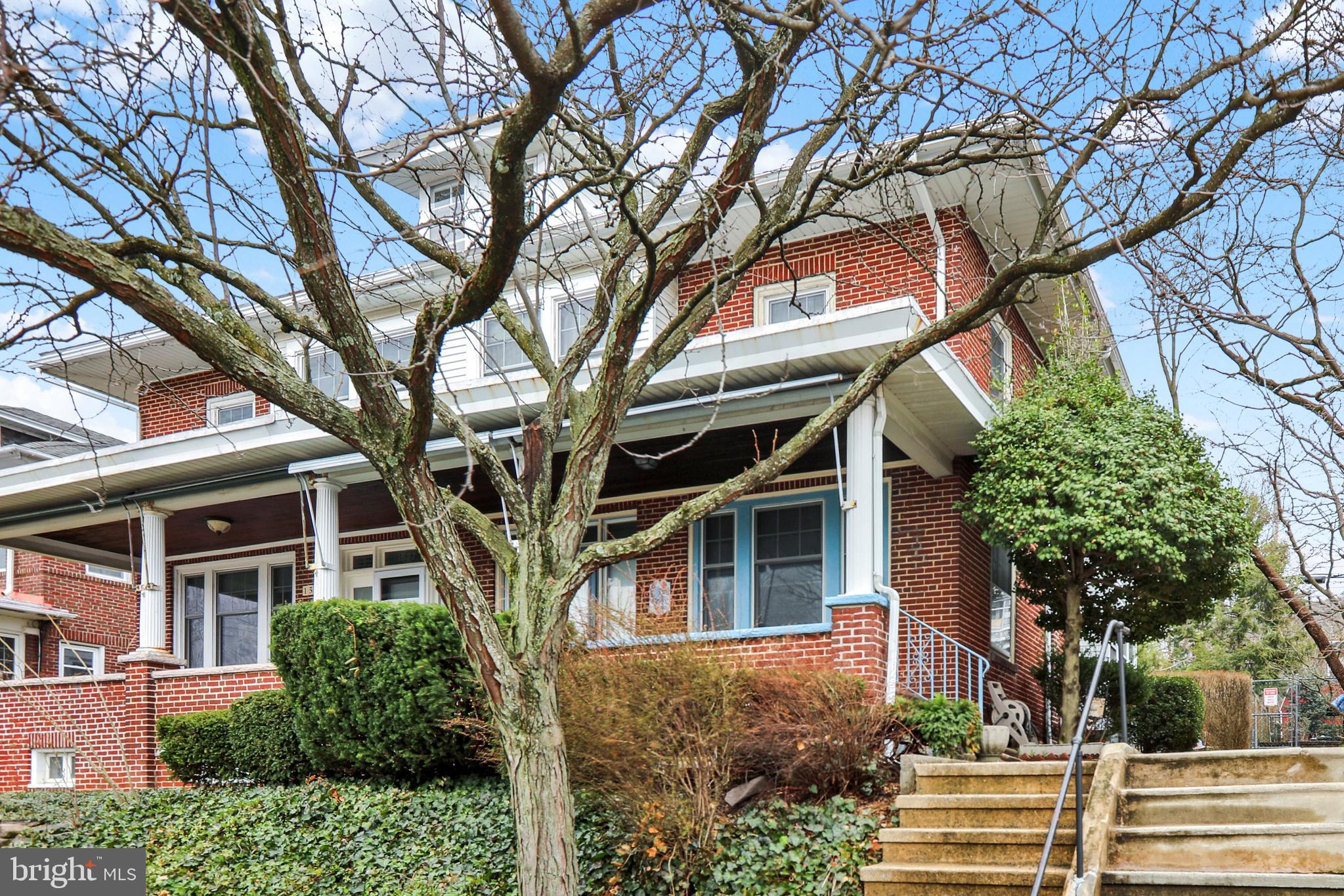 1525 North 14th Street Reading, PA 19604 - Photo 1 of 28 front view of a house with a tree