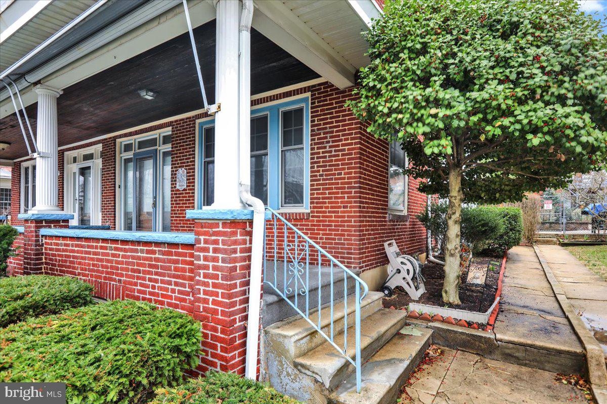 1525 North 14th Street Reading, PA 19604 - Photo 3 of 28 front view of a house with a porch
