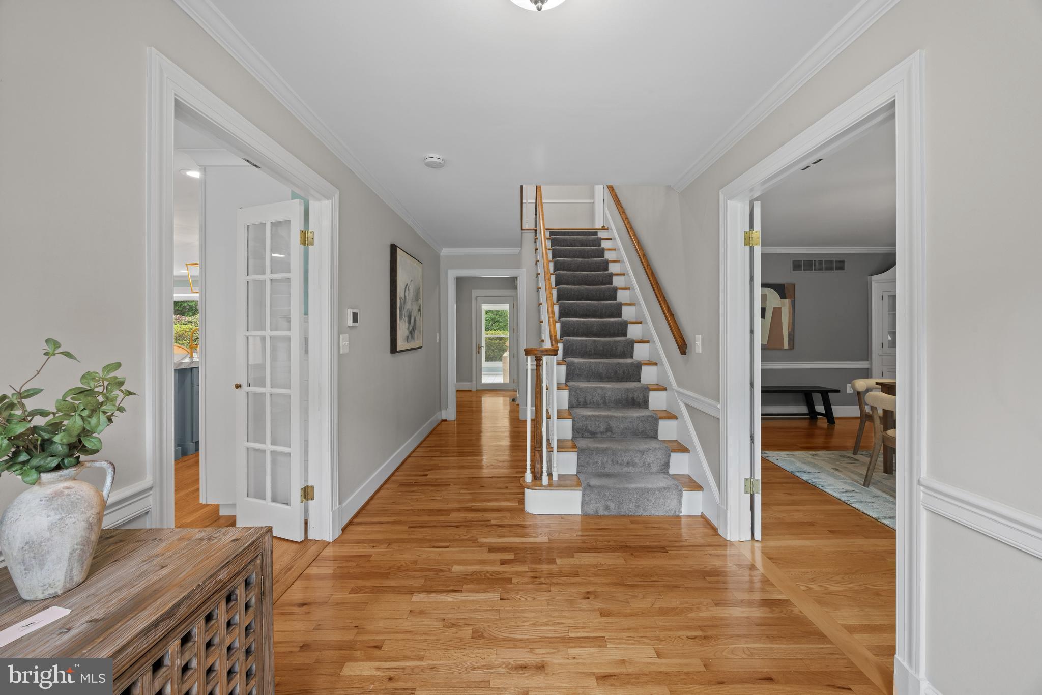 3484 Olympia Road Davidsonville, MD 21035 - Photo 5 of 50 a view of a hallway with wooden floor and stairs