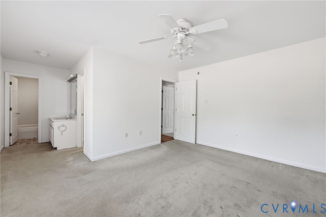 5816 Abilene Road Farmville, VA 23901 - Photo 12 of 26 an empty room with chandelier fan