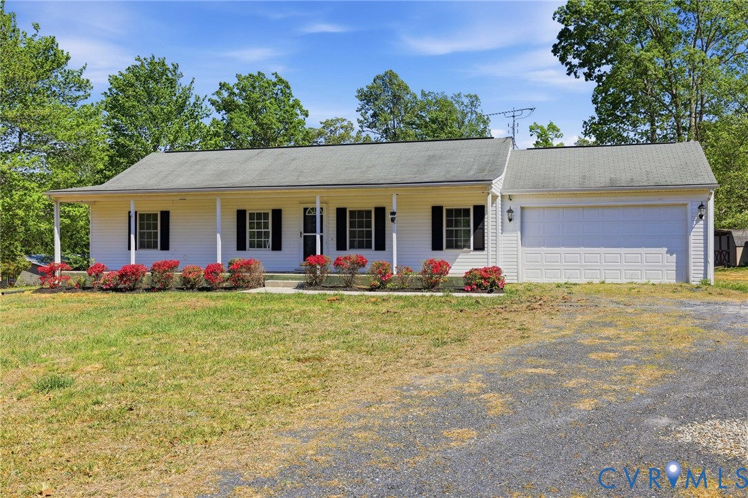 5816 Abilene Road Farmville, VA 23901 - Photo 3 of 26 front view of a house with a yard and potted plants