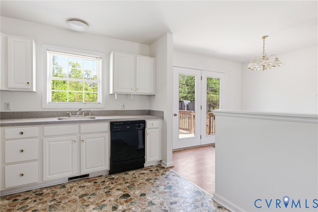 5816 Abilene Road Farmville, VA 23901 - Photo 8 of 26 a kitchen with granite countertop a stove a sink and a microwave