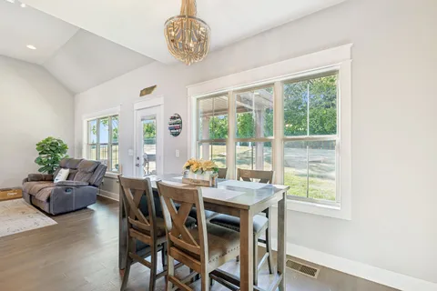 a view of a dining room with furniture window and outside view