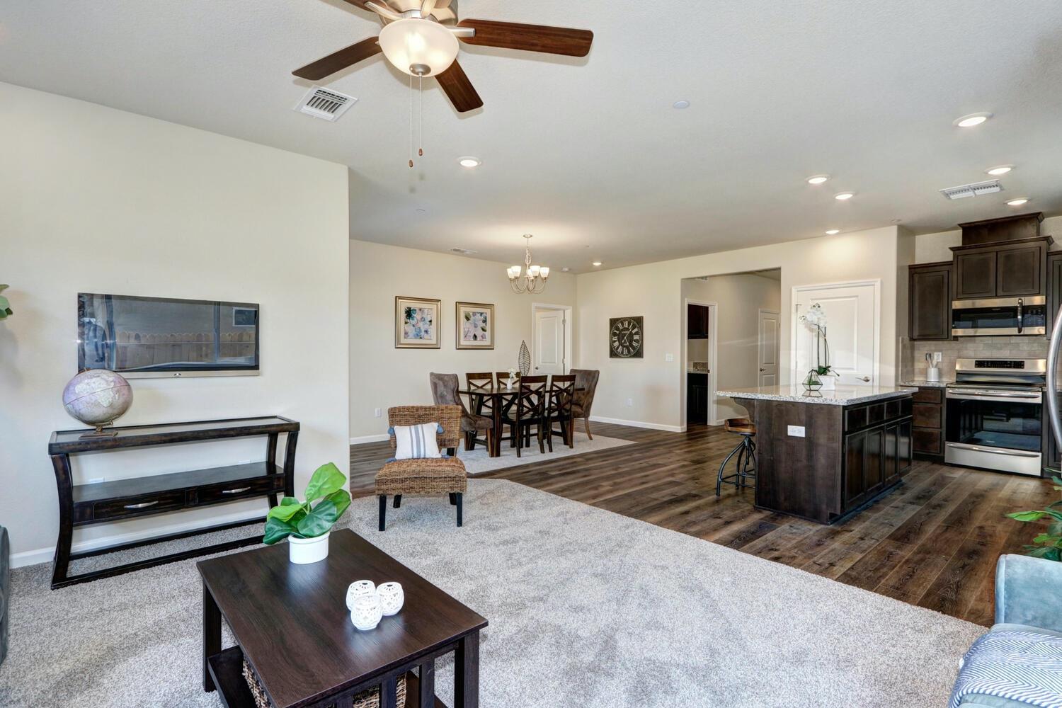1071 Hogan Road Galt, CA 95632 - Photo 11 of 17 a living room with furniture and a wooden floor