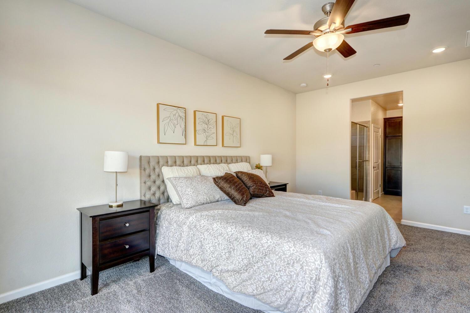 1071 Hogan Road Galt, CA 95632 - Photo 15 of 17 a bedroom with a bed and a chandelier