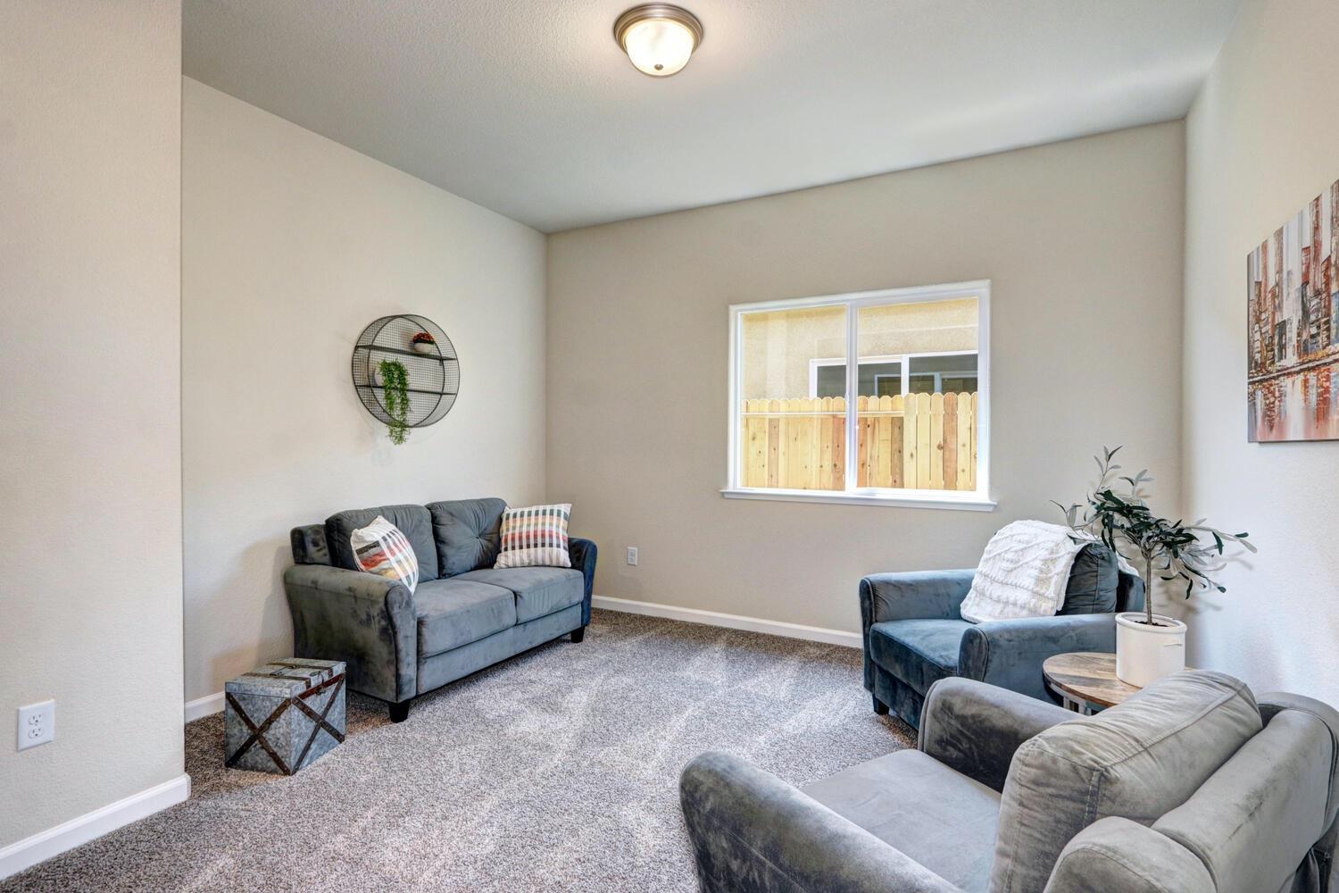 1071 Hogan Road Galt, CA 95632 - Photo 3 of 17 a living room with furniture and a window