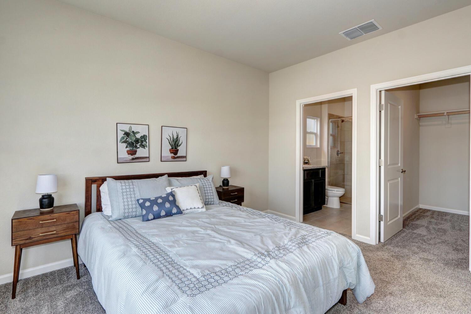 1071 Hogan Road Galt, CA 95632 - Photo 4 of 17 a bedroom with a bed and a painting on the wall