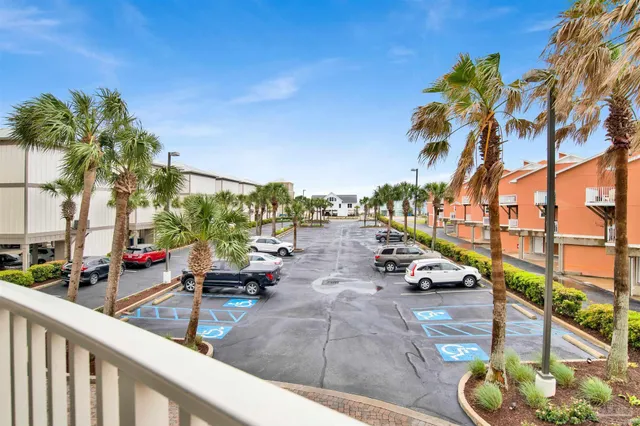 a view of a swimming pool with a lounge chair and swimming pool