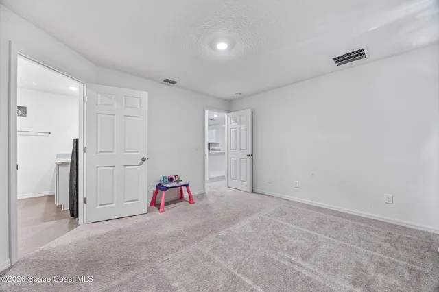 a bathroom with a shower and a sink