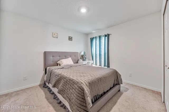 a view of a bedroom with closet