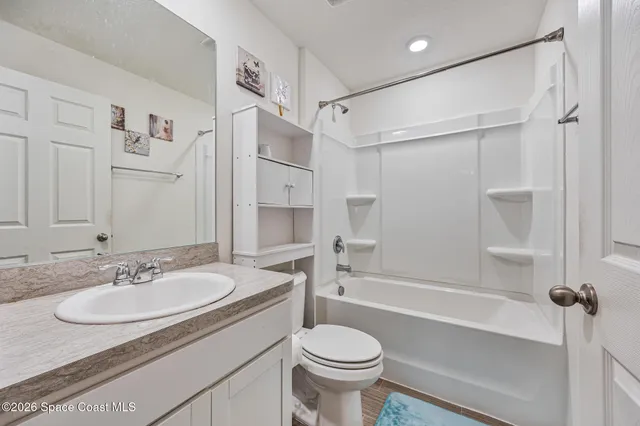 a bedroom with a bed and a cabinets