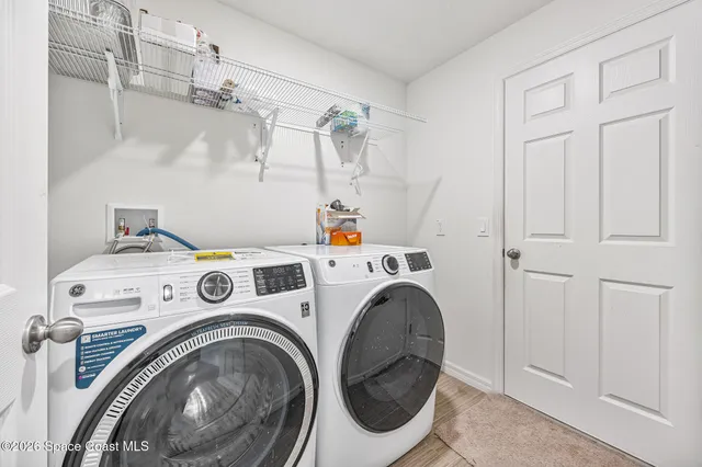 a view of a patio with table and chairs stove and wooden floor